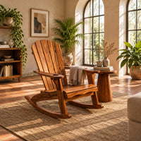 Adirondack style rocking chair with a slatted fan back and wide armrests in a bright living room with arched windows and plants