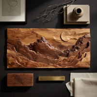 Detail of panoramic amber mountain valley wall art beside wood, brass and linen samples