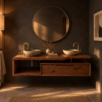 Floating bathroom vanity cabinet with a stepped slab top and open cubby in a dark bathroom at golden hour