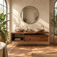 Floating bathroom vanity cabinet with a stepped slab top and open cubby in a bright bathroom with arched windows and plants