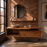 Floating bathroom vanity cabinet with a stepped slab top and open cubby in an industrial loft bathroom with exposed brick