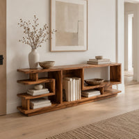 Open shelf console table with stepped square cubbies on a slim plinth in a Scandinavian entryway with white walls