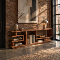 Open shelf console table with stepped square cubbies on a slim plinth in an industrial loft entryway with exposed brick