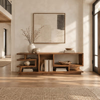 Open shelf console table with stepped square cubbies on a slim plinth in a bright open plan entryway