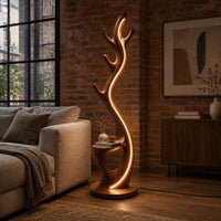 Tall floor lamp shaped like an antler with a hollow in the lower body in an industrial loft living room with exposed brick