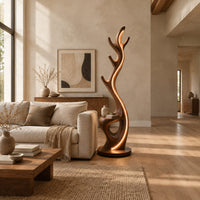 Tall floor lamp shaped like an antler with a hollow in the lower body in a bright open plan living room