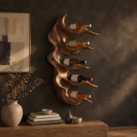 Antler style wine holder with stacked prongs and flowing grain in a dark studio against a charcoal plaster wall