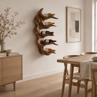 Antler style wine holder with stacked prongs and flowing grain in a Scandinavian dining room with white walls