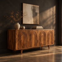 Sideboard with four arch carved doors and slim tapered legs, three-quarter view showing the grain