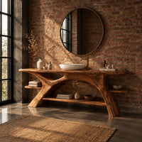 Branch leg bathroom vanity with a slab top, open lower shelf and side ledges in an industrial loft bathroom with exposed brick