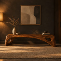 Arched bench with oval cutouts in the end legs in a dark entryway at golden hour