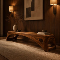 Arched bench with oval cutouts in the end legs in an evening entryway with walnut wall paneling