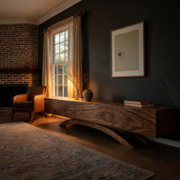 Four door TV cabinet on arched sculpted legs in a living room at golden hour
