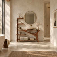Asymmetric bathroom vanity with a tall side shelf stack and a swept leg in a bright open plan bathroom