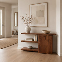 Asymmetric console table with two open shelves beside a closed wood block in a Scandinavian entryway with white walls