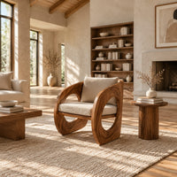 Barrel lounge chair with round cutouts in curved side panels in a bright open plan living room