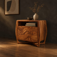 Barrel sided nightstand with an open top cubby and a swirled grain front, three-quarter view showing the grain