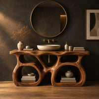 Bathroom vanity with a twin loop base and a thick slab top in a dark studio against a charcoal plaster wall