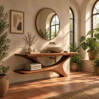 Wooden bathroom vanity with a forked branch base and lower shelf in a bright bathroom with arched windows and plants