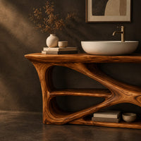 Corner detail of freestanding vanity on a branching loop frame with open shelf spaces beside wood, brass and linen samples