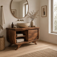 Bathroom vanity with an open cubby and one door on flared feet in a Scandinavian bathroom with white walls