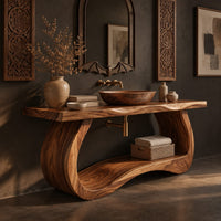Corner detail of bathroom vanity with a thick slab top on a sculpted loop base beside wood, brass and linen samples