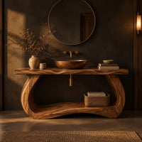Bathroom vanity with a thick slab top on a sculpted loop base in a dark bathroom at golden hour