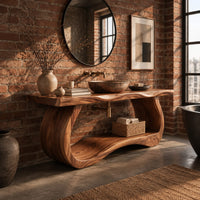 Bathroom vanity with a thick slab top on a sculpted loop base in an industrial loft bathroom with exposed brick