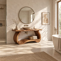 Bathroom vanity with a thick slab top on a sculpted loop base in a bright open plan bathroom