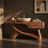 Corner detail of bathroom vanity with a thick top, single drawer and twisting trunk base beside wood, brass and linen samples