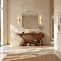Bathroom vanity with a thick top, single drawer and twisting trunk base in a bright open plan bathroom