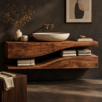 Corner detail of bathroom vanity with a thick wood top and an open wavy lower shelf beside wood, brass and linen samples