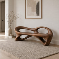 Bench with a flowing frame and large oval openings in a Scandinavian entryway with white walls