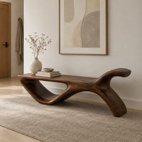 Long flat bench with an open loop base and one raised end in a Scandinavian entryway with white walls