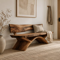 Bench with a natural edge slab back and angled arched legs in a Scandinavian entryway with white walls