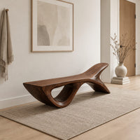 Bench with a fish tail upsweep and a large open arch in a Scandinavian entryway with white walls
