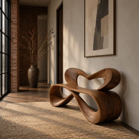 Bench with a heart shaped open back and a folded ribbon seat in an industrial loft entryway with exposed brick