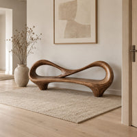 Bench with an open loop backrest and sculpted feet in a Scandinavian entryway with white walls
