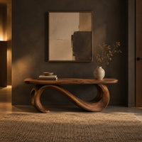 Bench with a plank seat on an s shaped scroll base in a dark entryway at golden hour