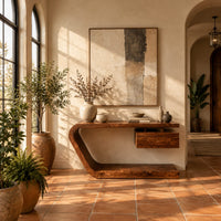 Console table with a bent slab frame and a floating box under the top in a bright entryway with arched windows and plants