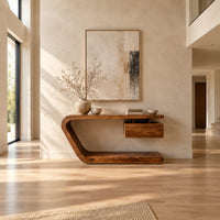 Console table with a bent slab frame and a floating box under the top in a bright open plan entryway