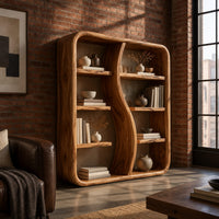 Bookshelf with a wavy s shaped divider and staggered shelves in an industrial loft living room with exposed brick