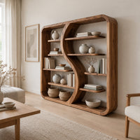 Bookshelf with a flowing s shaped divider and a softly shaped frame in a Scandinavian living room with white walls