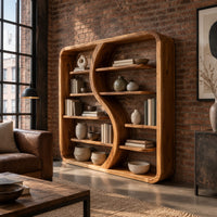 Bookshelf with a flowing s shaped divider and a softly shaped frame in an industrial loft living room with exposed brick