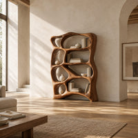 Tall bookshelf made of free form open cells with a sculpted outline in a bright open plan living room
