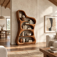 Tall free form wood bookshelf with a wavy outline and open shelves in a bright open plan living room