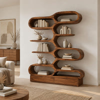 Bookshelf with staggered pill shaped open cubbies above a low base in a Scandinavian living room with white walls