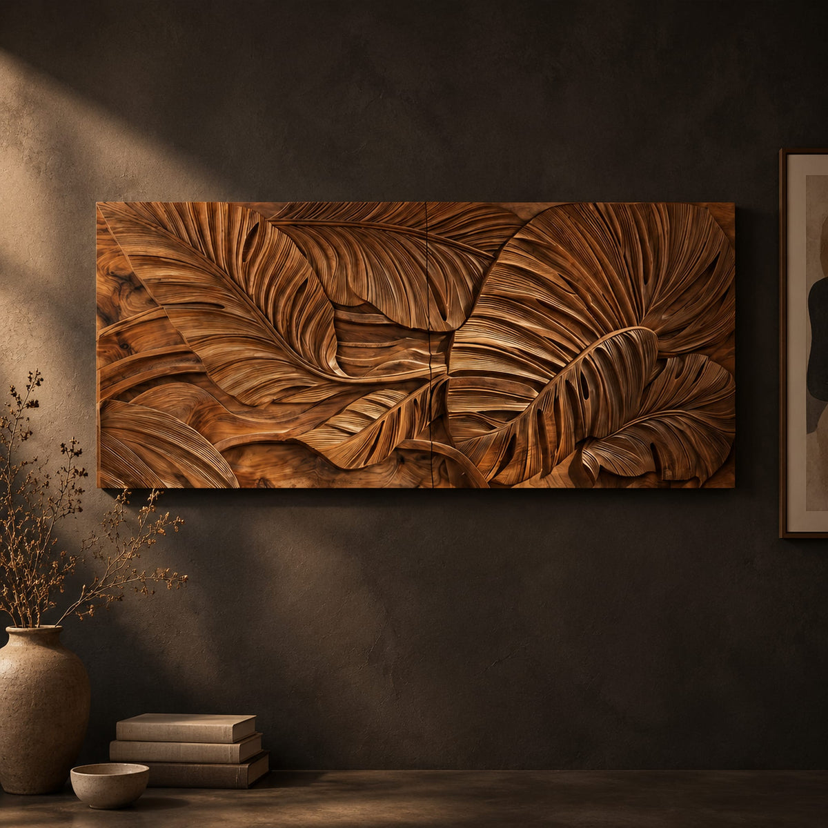 Carved wood wall art panel with overlapping tropical leaves in deep relief on a dark charcoal plaster wall