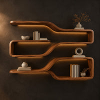 Three looped wood shelf frames that narrow like bottle necks in a dark studio against a charcoal plaster wall
