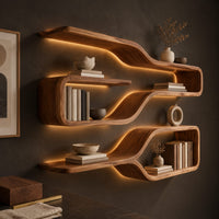 Corner detail of three looped wood shelf frames that narrow like bottle necks beside wood, brass and linen samples
